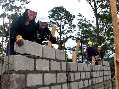 Students building a wall